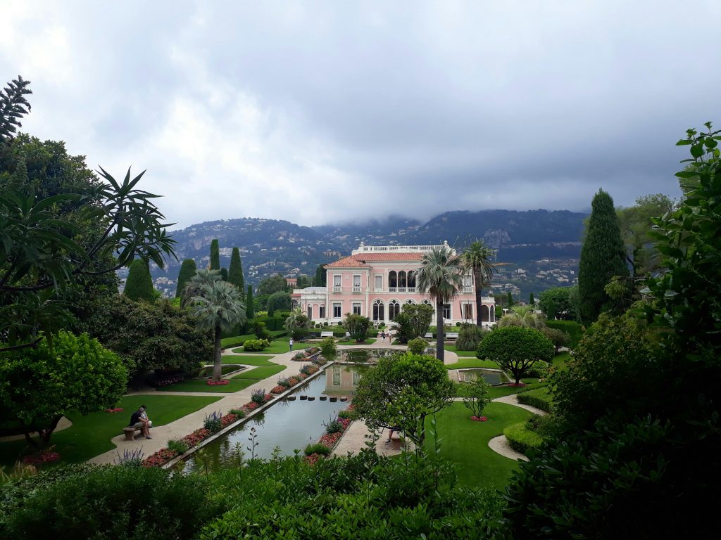 A luxurious mansion surrounded by beautifully designed gardens in Nice, France.